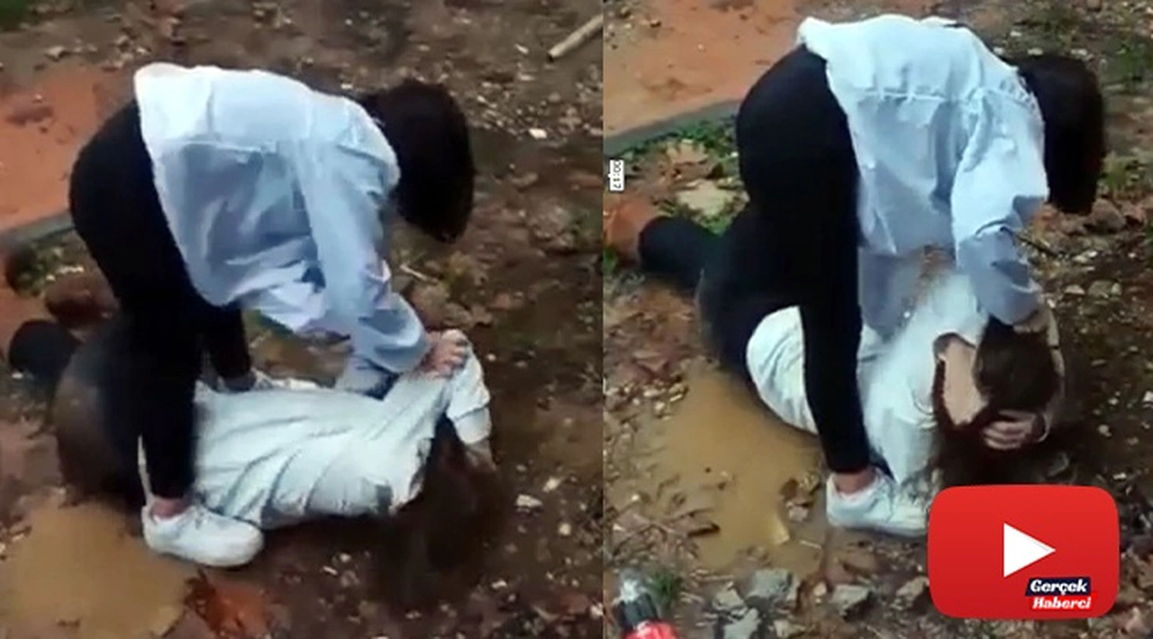 Genç kız saçından tutarak yere yatırdığı arkadaşını acımasızca dövdü
