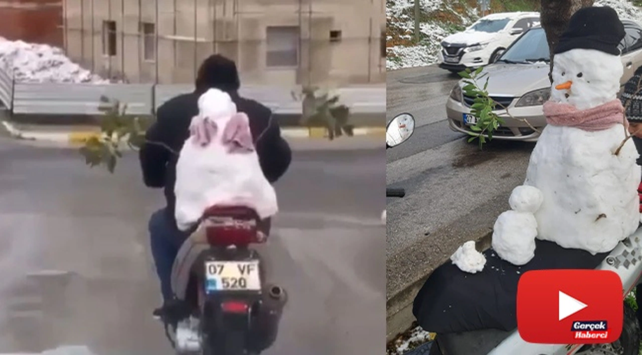 Motosikletin arkasındaki kardan adam ile şehir turu attı