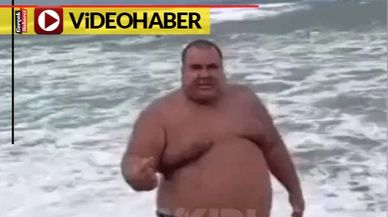 Tehlikeli yerde yüzmeye kalktı, engel olmak isteyen görevlilere hakaretler saydı