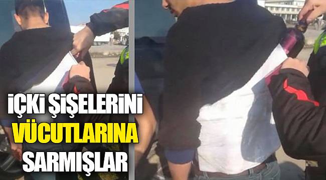 İçki şişelerini vücutlarına sarmışlar