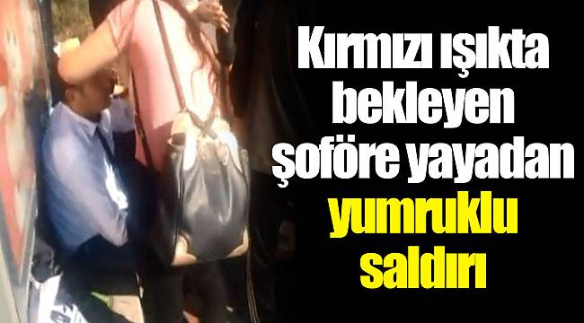 Kırmızı ışıkta bekleyen şoföre yayadan yumruklu saldırı