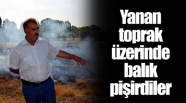 Yanan toprak üzerinde balık pişirdiler