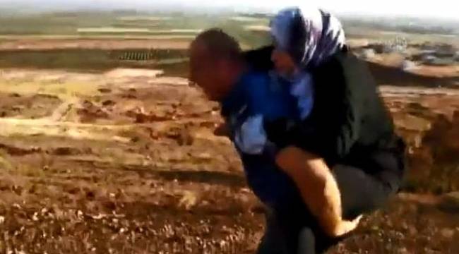 Polis yaralı Suriyeliyi 2 kilometre sırtında taşıdı