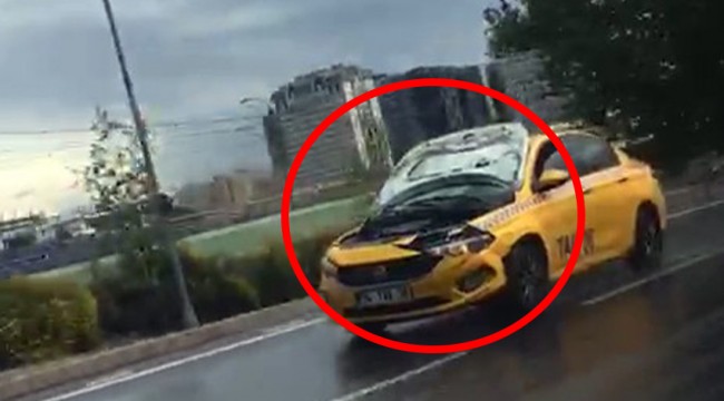 Kaputu açık halde seyreden taksi hayrete düşürdü