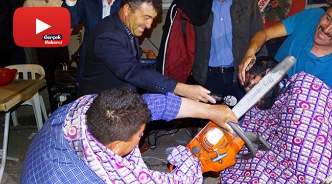 Köy düğününde motorlu testere ile tıraş