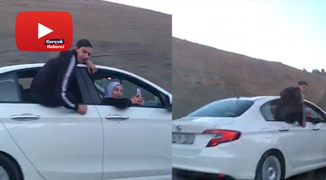 Otomobilin camında tehlikeli yolculuk