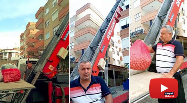 Asansörü olmayan binadaki dairesine pazar alışverişini vinçle çıkardı