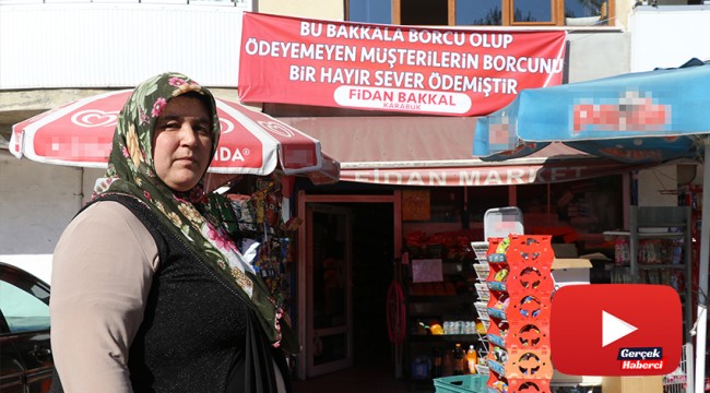 Veresiye defterindeki borçları kapattı, "Borcunuz ödendi pankartı" astırdı