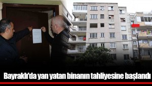 Bayraklı'da yan yatan binanın tahliyesine başlandı