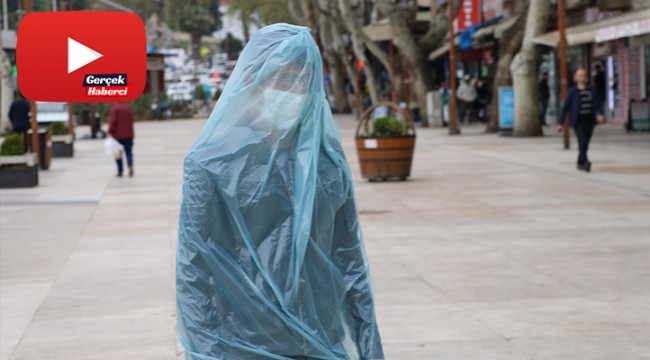 Korona virüsten çöp poşetiyle korunuyor