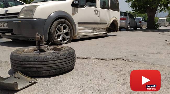 Kazaya yapan aracın kopan tekerliği mağaza camından içeri girdi