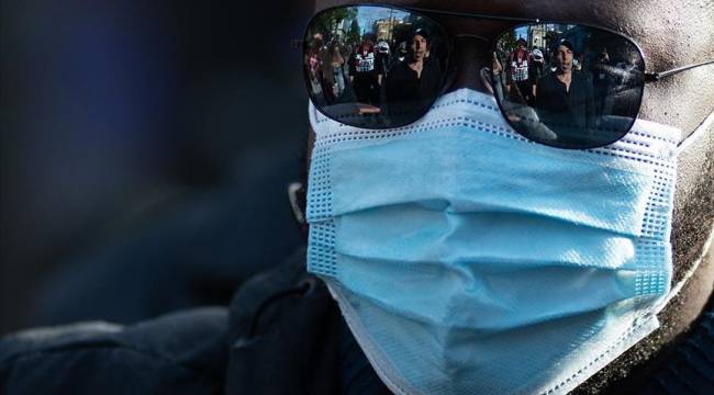 ABD'de günlük Kovid-19 vakaları hızla artarken maske tartışmaları devam ediyor