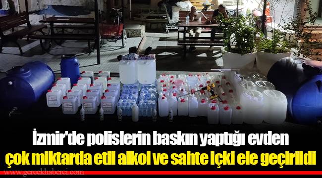 İzmir'de polislerin baskın yaptığı evden çok miktarda etil alkol ve sahte içki ele geçirildi