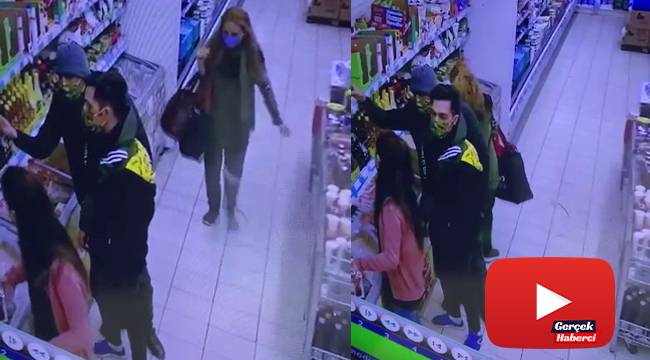 Markette kadın şahsın kaşla göz arasında telefon çaldığı anlar kamerada