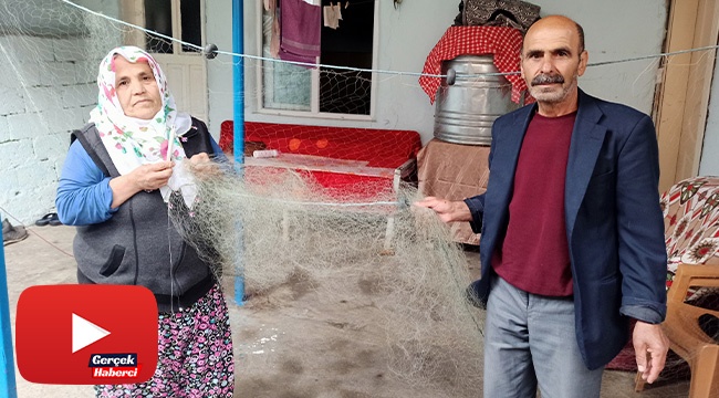 O ağları örüyor kocası balık avlıyor