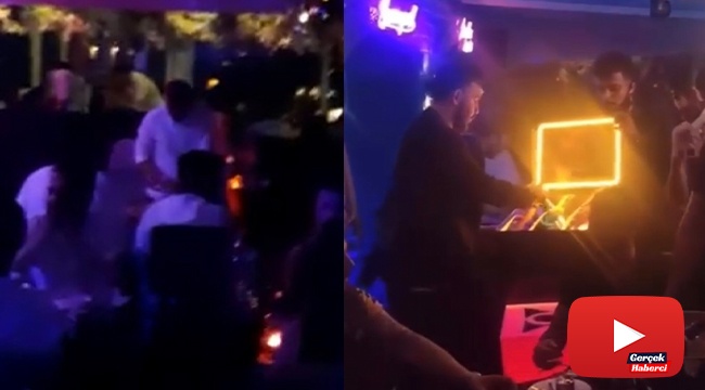 Kısıtlamada otel terasında meşaleli doğum günü partisi kamerada