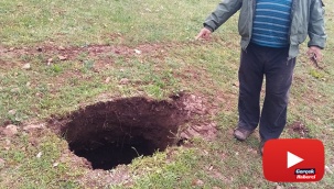Tarlada oluşan 10 metrelik çukur vatandaşları tedirgin etti