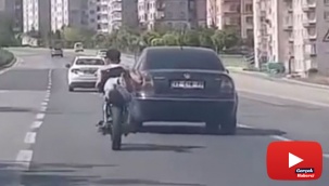 Motosiklet üzerinde tehlikeli yolculuk