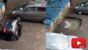 Park halindeki otomobil saniyeler içinde su dolu çukura gömüldü