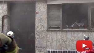 Vatandaşlar, yangında mahsur kalan kediyi kurtarmak için dumanların arasına daldı