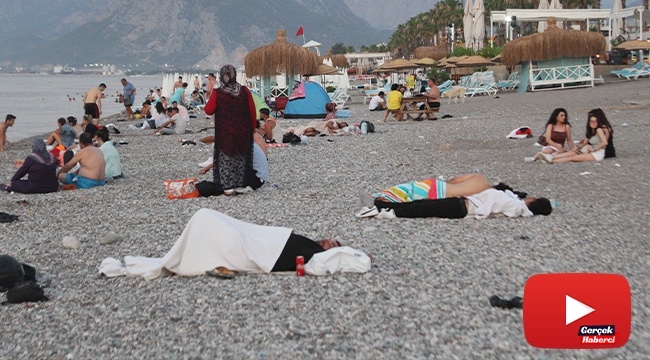 Aşırı sıcakların etkisindeki Antalya'da sahiller açık hava oteline döndü