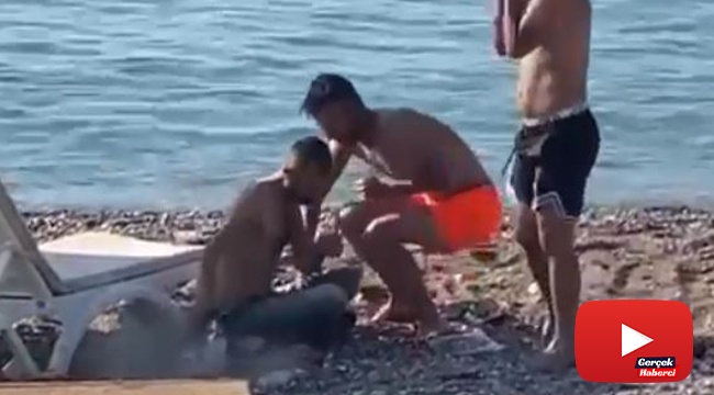 Dünyaca ünlü sahilde oynadığı tabanca ateş alan maganda herkesi korkuttu