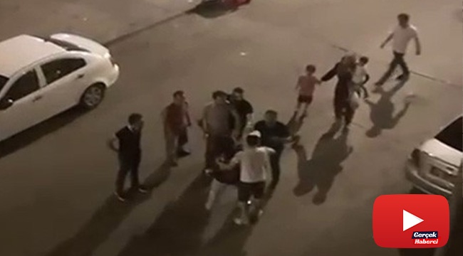 Eşine şiddet uyguladığı için darp edilmek istenen adam, yine eşinin arkasına saklandı