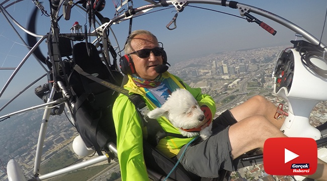 Köpeğinin doğum gününü gökyüzünde uçurarak kutladı