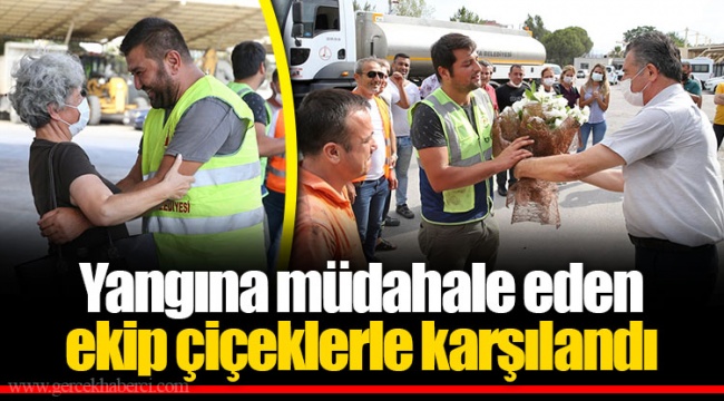 Yangına müdahale eden ekip çiçeklerle karşılandı