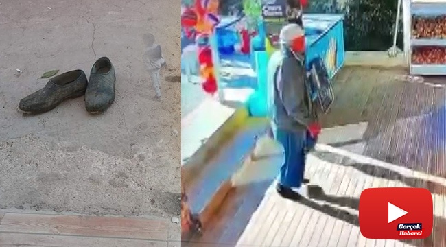 Market kirlenmesin diye çamurlu ayakkabılarını çıkarıp çoraplarıyla içeri girdi