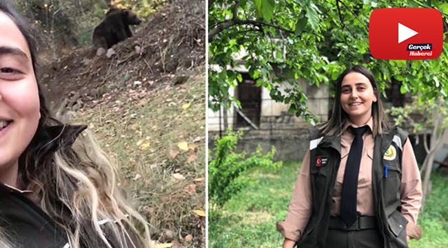 Orman muhafaza memuru genç kadın ayı ile özçekim yaptı