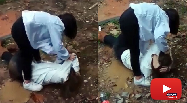 Genç kız saçından tutarak yere yatırdığı arkadaşını acımasızca dövdü