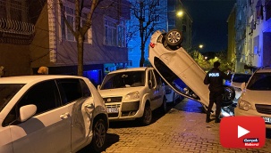 Park halindeki araçlara çarpıp dik bir şekilde havada asılı kaldı