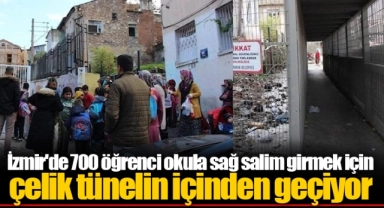 İzmir'de 700 öğrenci okula sağ salim girmek için çelik tünelin içinden geçiyor