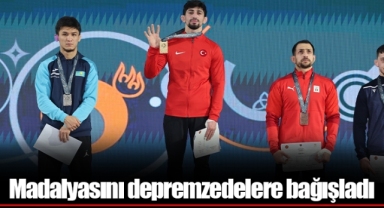 Madalyasını depremzedelere bağışladı