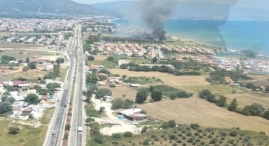 Seferihisar'da sazlık alanda yangın söndürüldü
