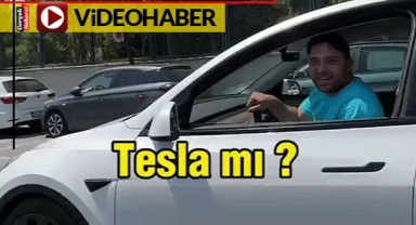 Tesla sürücüsü, "TOGG daha güzel" deyince çekim yapan kişi "O zaman sat TOGG al"