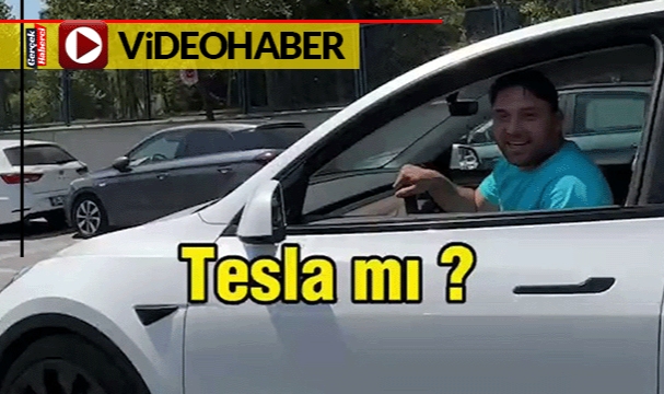 Tesla sürücüsü, "TOGG daha güzel" deyince çekim yapan kişi "O zaman sat TOGG al"