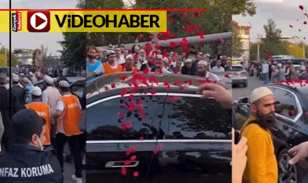 Devlet memuru Menzil şeyhinin lüks aracını güllerle karşıladı