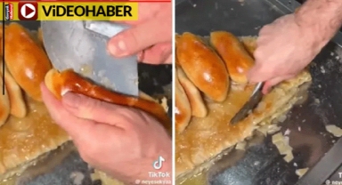 Börekli poğaça yaptı, müşteriye tartarak sattı