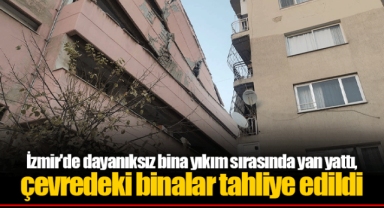 İzmir'de dayanıksız bina yıkım sırasında yan yattı, çevredeki binalar tahliye edildi