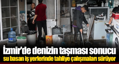 İzmir'de denizin taşması sonucu su basan iş yerlerinde tahliye çalışmaları sürüyor