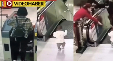 Annesini beklemeden yürüyen merdivene koştu, güvenlik son anda böyle kurtardı