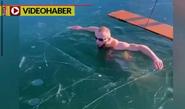 Donmuş göle dalan yüzücü az kalsın ölüyordu