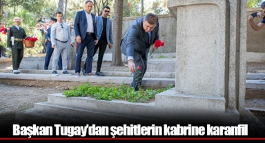 Başkan Tugay’dan şehitlerin kabrine karanfil