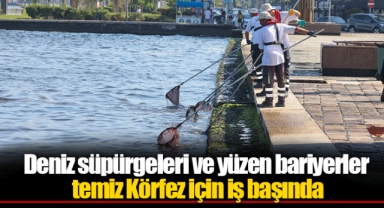 Deniz süpürgeleri ve yüzen bariyerler temiz Körfez için iş başında