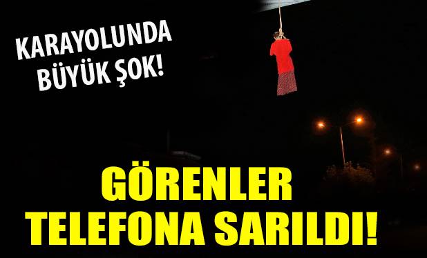 Trafik uyarı levhasına cansız manken astılar
